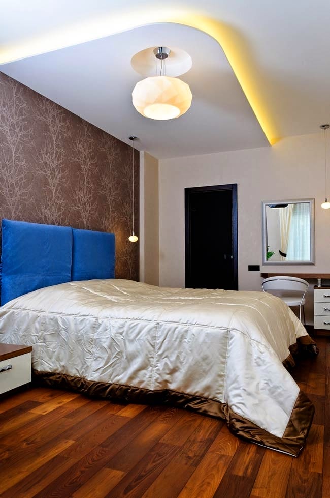 apartment design - bedroom with false ceiling and wooden floor