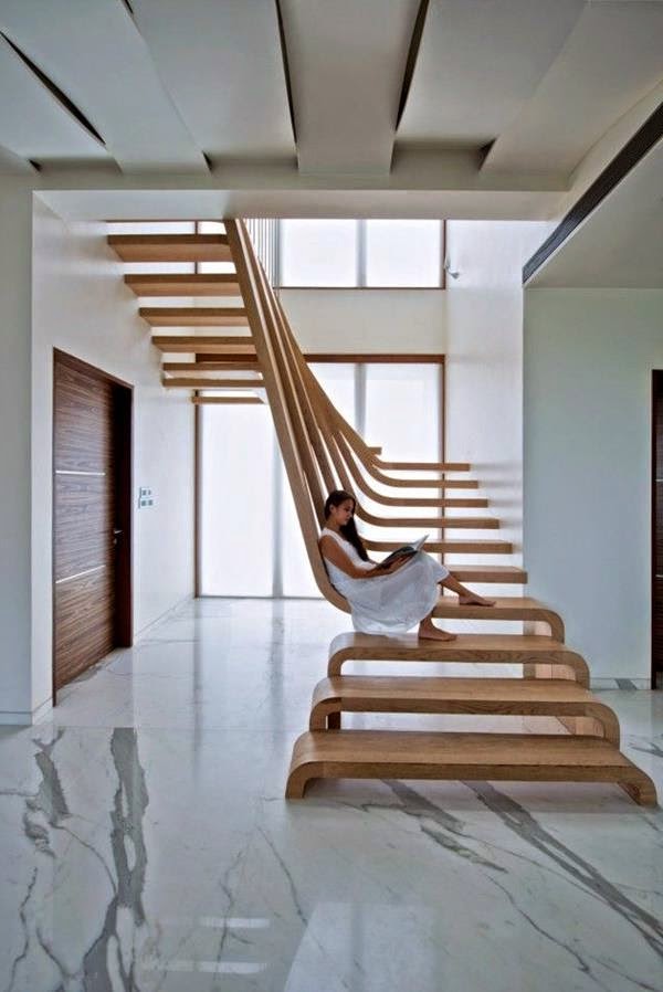 creative wooden stairs with original staircase railing in modern interior