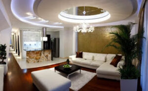 False ceiling design made of gypsum with hidden lighting and a reflective tray.